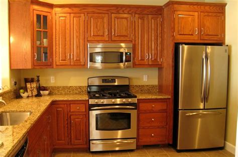 stainless steel appliances with honey oak cabinets|honey oak kitchen cabinets.